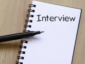 Interview text concept write on notebook
